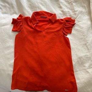 T Tahari orange blouse with short fringe sleeves. Collared neck with button.